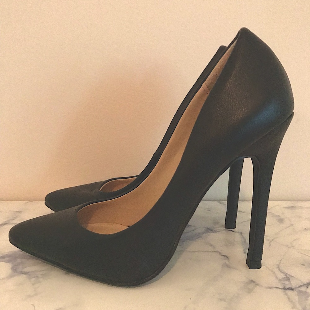 Black pointed toe pumps